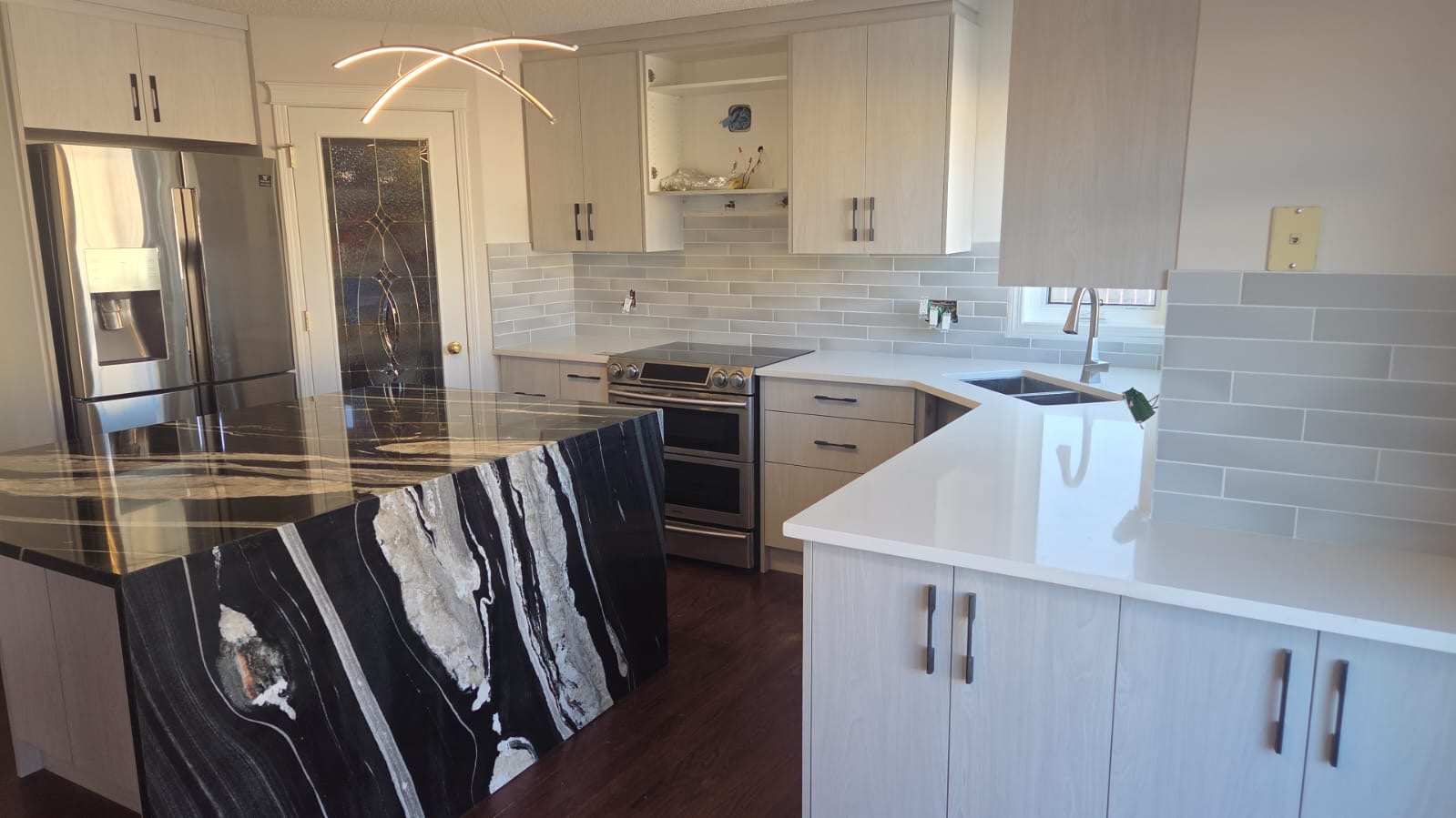 Diamond Granite & Quartz Corp project — black island kitchen