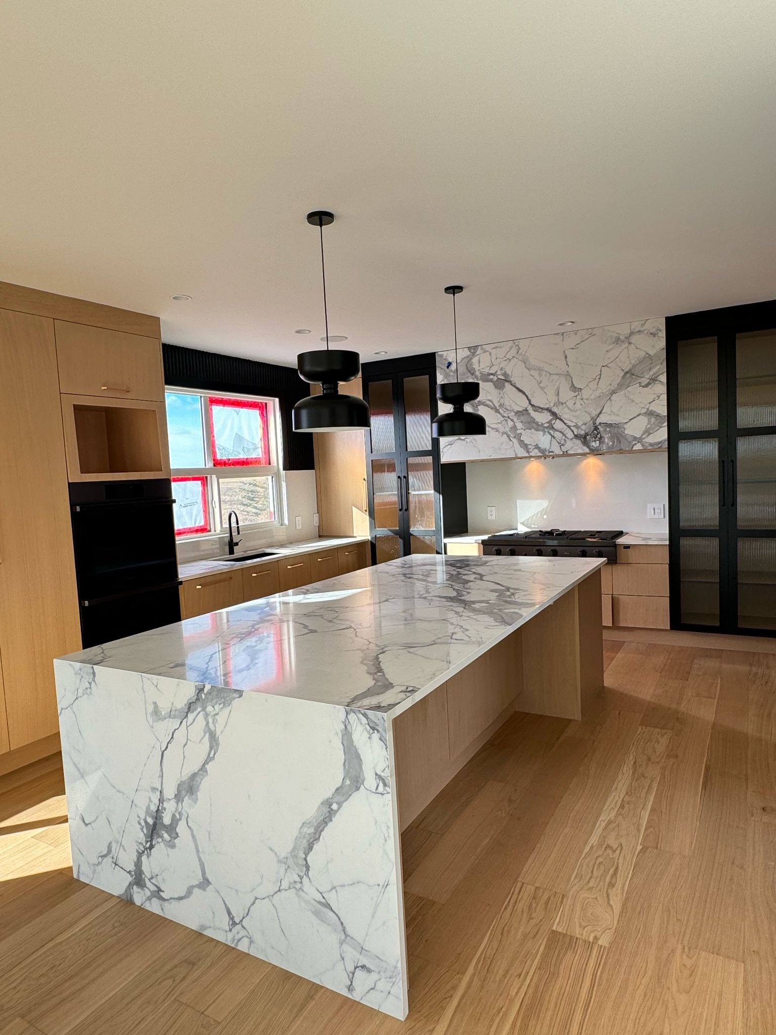 Diamond Granite & Quartz Corp project — calacatta waterfall island