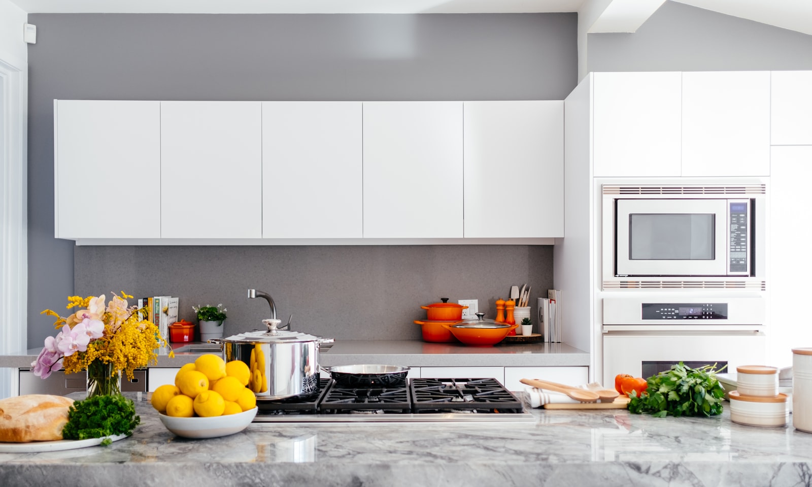 Polished granite kitchen countertop and island with veined natural stone